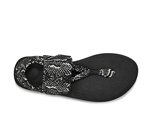 Top view of a black sandal with a patterned strap