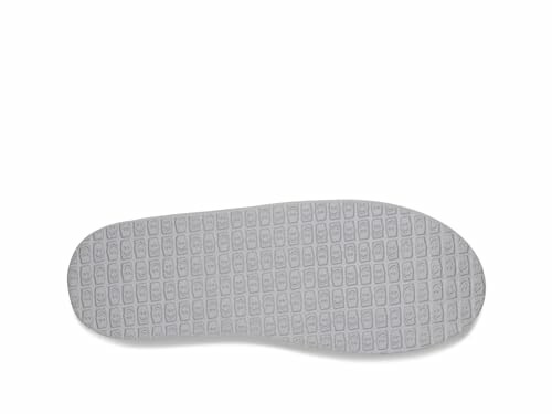 Gray shoe sole with textured pattern.